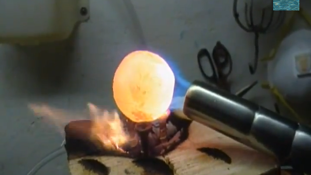 Watch What Happens When You Drop a White-Hot Nickel Ball on Ice